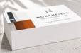 Stack of custom printed 24pt recycled uncoated business cards for Northfield Architectural Studio showing extra thick paper edge quality