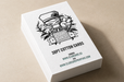 Stack of ultra thick 38pt white cotton letterpress business cards featuring a black line-art character illustration and Clubcard logo embossed words club card on an iridescent foil. 