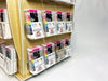 Angled view of 16-pocket birch plywood countertop card spinner filled with sticker packs - Clubcard Printing USA