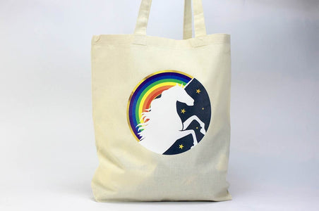 Natural cotton tote bag custom printed with a full-color rainbow and unicorn silhouette graphic
