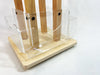 Close-up view of clear acrylic pockets mounted on a birch plywood countertop card spinner by Clubcard Palm Springs