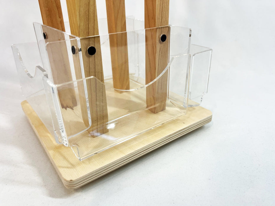 Close-up view of clear acrylic pockets mounted on a birch plywood countertop card spinner by Clubcard Palm Springs