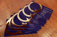 Raised gold foil business cards printed on 19pt suede stock with letter Q in raised gold metallic