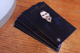Raised silver foil business cards printed on 19pt suede stock with logo in raised silver metallic