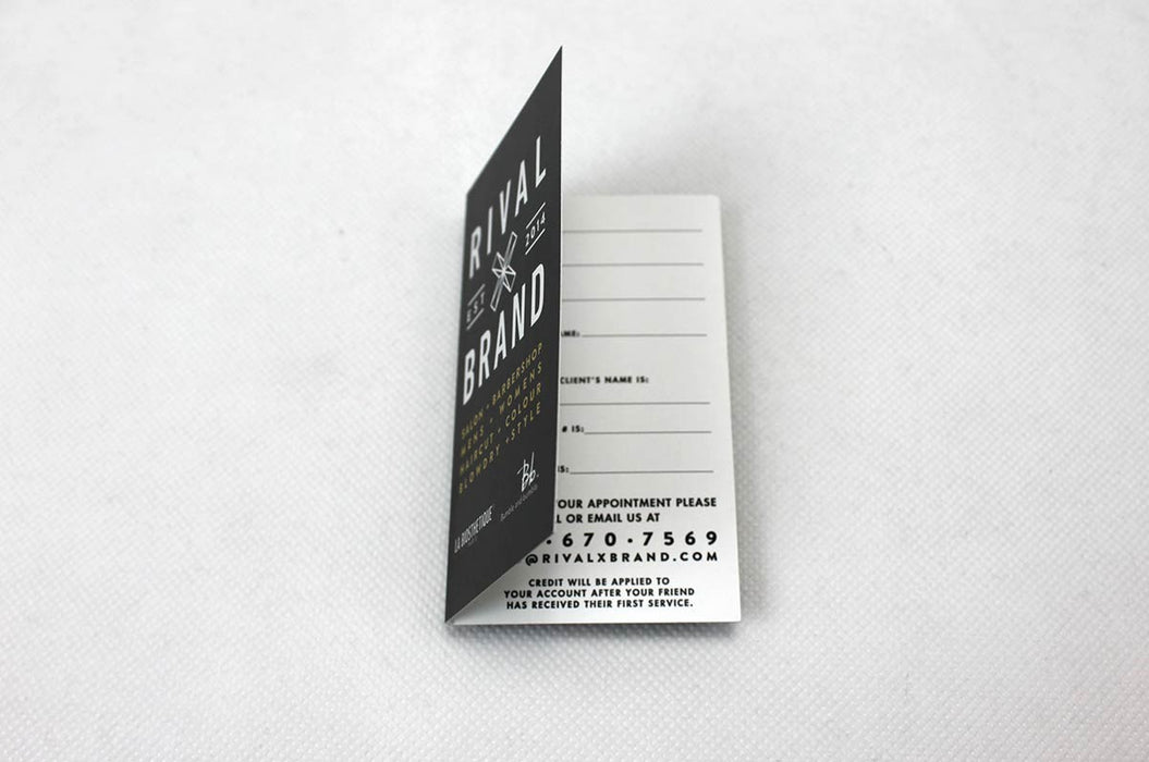 Custom folding business card printed in full color on 14pt coated stock for Rival x Brand | Business card is designed vertically with the fold along the long side, and opens like a book | Clubcard Printing USA