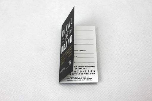 Custom folding business card printed in full color on 16pt Foil Effects stock for Rival x Brand | Business card is designed vertically with the fold along the long side, and opens like a book | Clubcard Printing USA