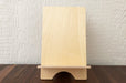 Birch Plywood book display stand on a wooden table.