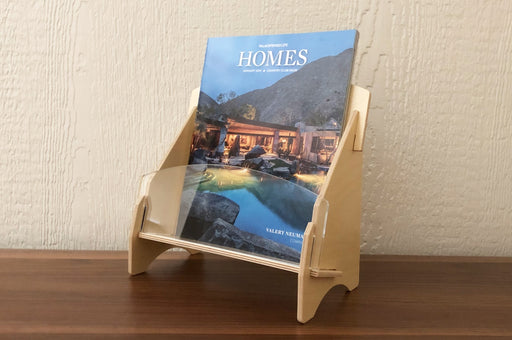 Birch plywood full size brochure holder with acrylic front panel displaying Palm Spring Life's publication Homes.